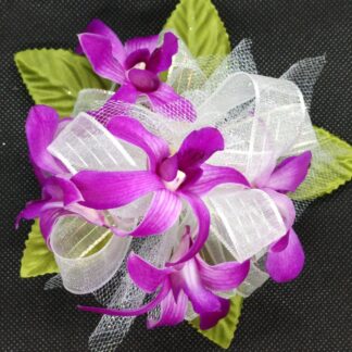 Purple Orchids Circular Wristlet Corsage