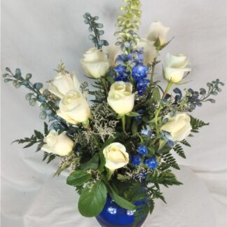 A Dozen Roses With Blue Flowers