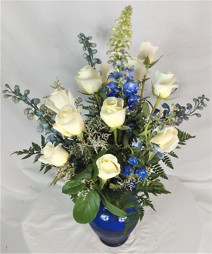A Dozen Roses With Blue Flowers